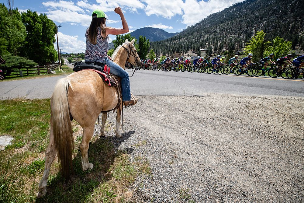 A horse and rider welcome the womens peloton to Nevada during stage 2 of the Amgen Tour of California Women's Race