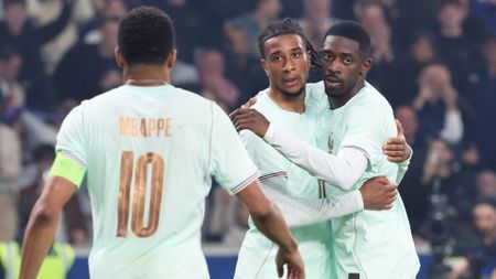 France's Michael Olise celebrating with Kylian Mbappe and Ousmane Dembele