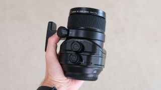 Fujinon GF 30mm F5.6 T/S being held in reviewer's hand