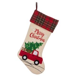 Christmas stocking with motif of a van carrying a Christmas tree