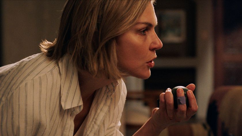 Carol bent over and holding a grenade in her left hand in Pluribus episode 3