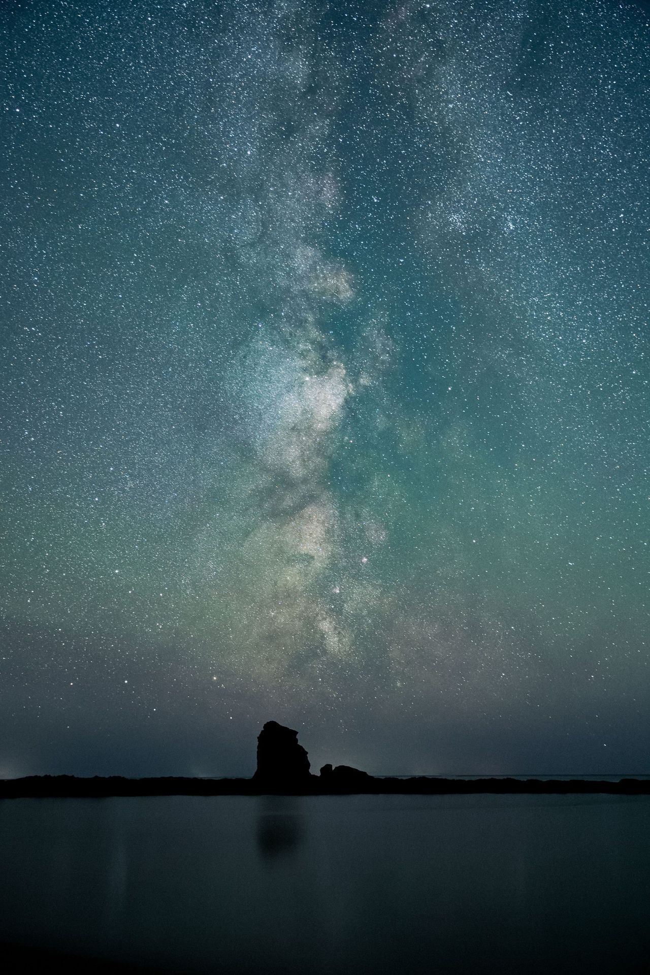 The Milky Way seen at Thurlestone Rock, off the coast of South Devon.