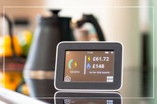 Smart meter on kitchen counter showing the price of gas and electric