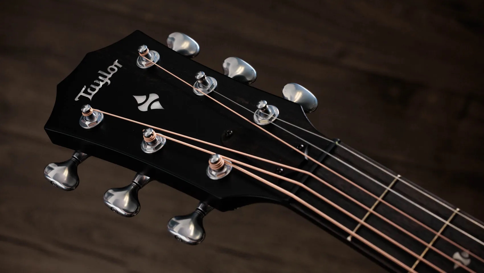 A photo showing a detail of the Taylor Next Generation 514ce Builder&rsquo;s Edition in Kona Burst