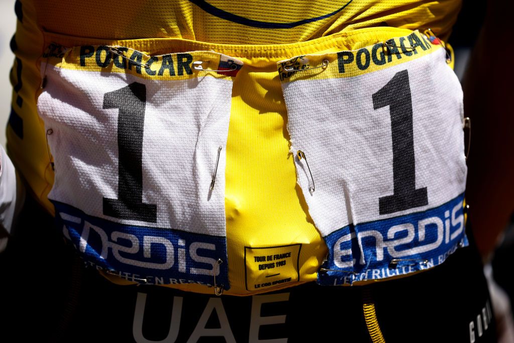 NMES FRANCE JULY 08 Tadej Pogaar of Slovenia and UAETeam Emirates Yellow Leader Jersey at start during the 108th Tour de France 2021 Stage 12 a 1594km stage from SaintPaulTroisChateaux to Nimes BIB Number Detail view LeTour TDF2021 on July 08 2021 in Nmes France Photo by Chris GraythenGetty Images