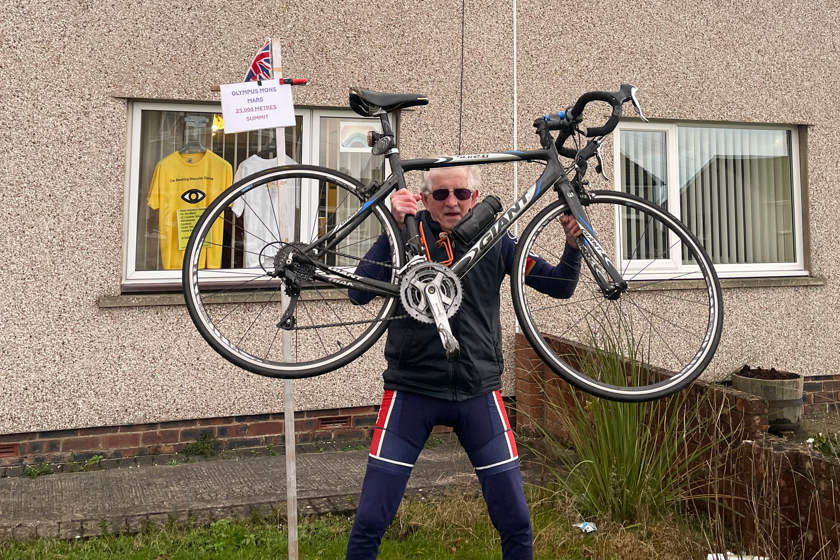 86-year-old Gerard McCarten with his Giant road bike