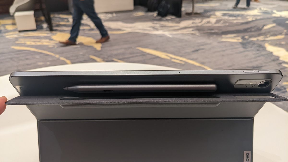 Lenovo Tab P11 Pro Gen 2 on a round wooden table.