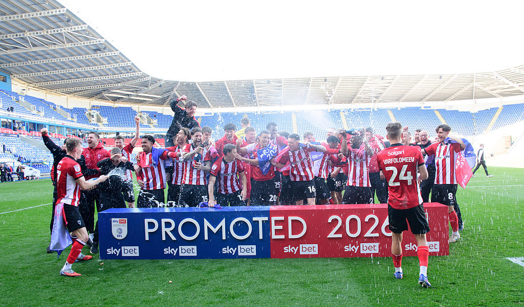 Lincoln City celebrate promotion to the Championship after beating Reading