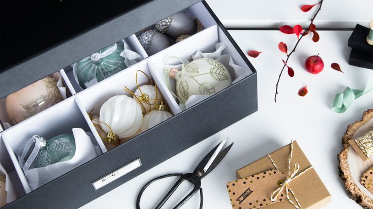 a ornament decorations storage box with scissors, presents etc - a place for everything 