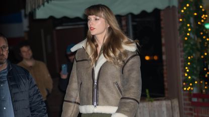 Taylor Swift in a shearling jacket and Miu Miu mini skirt