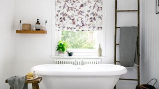 Rustic bathroom with floral roller blind