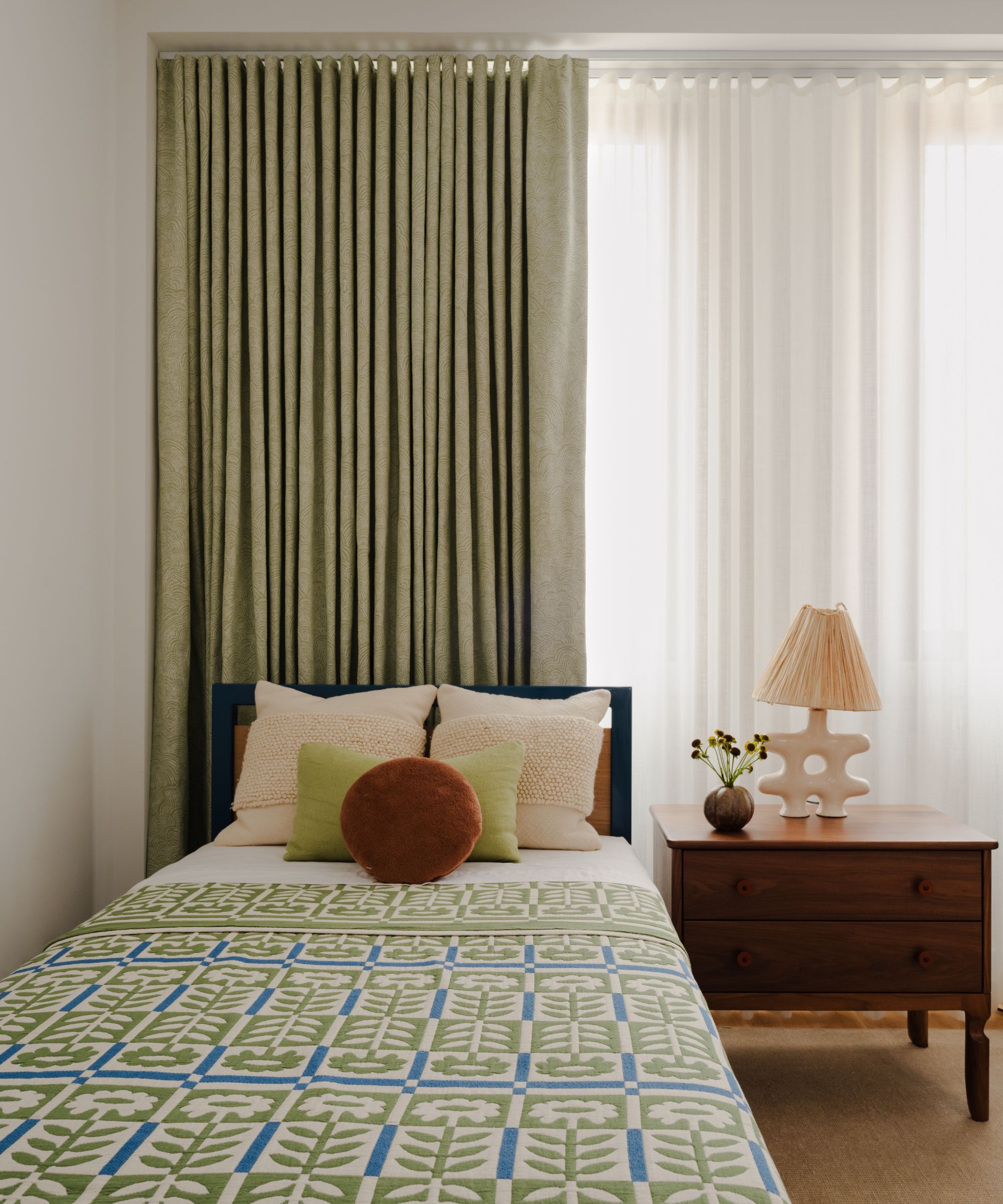 guest room green bed throw