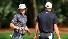 Peter Malnati speaks to Jordan Spieth during a practice round of The Players Championship