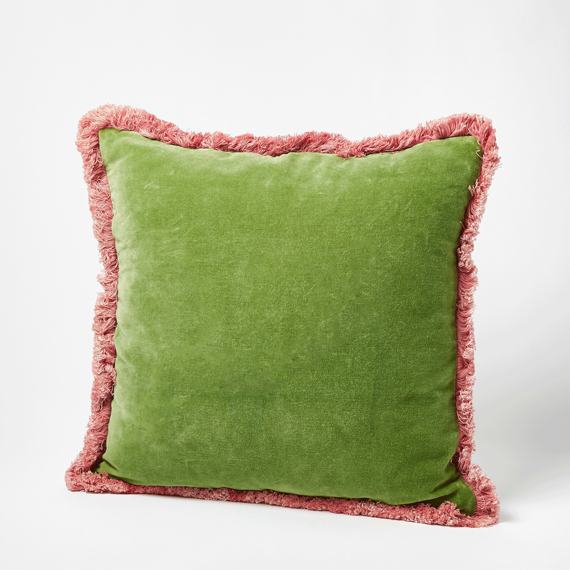 Green cushion with pink fringe