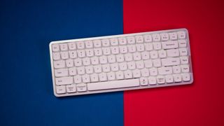 Lofree Flow keyboard on a blue and red background
