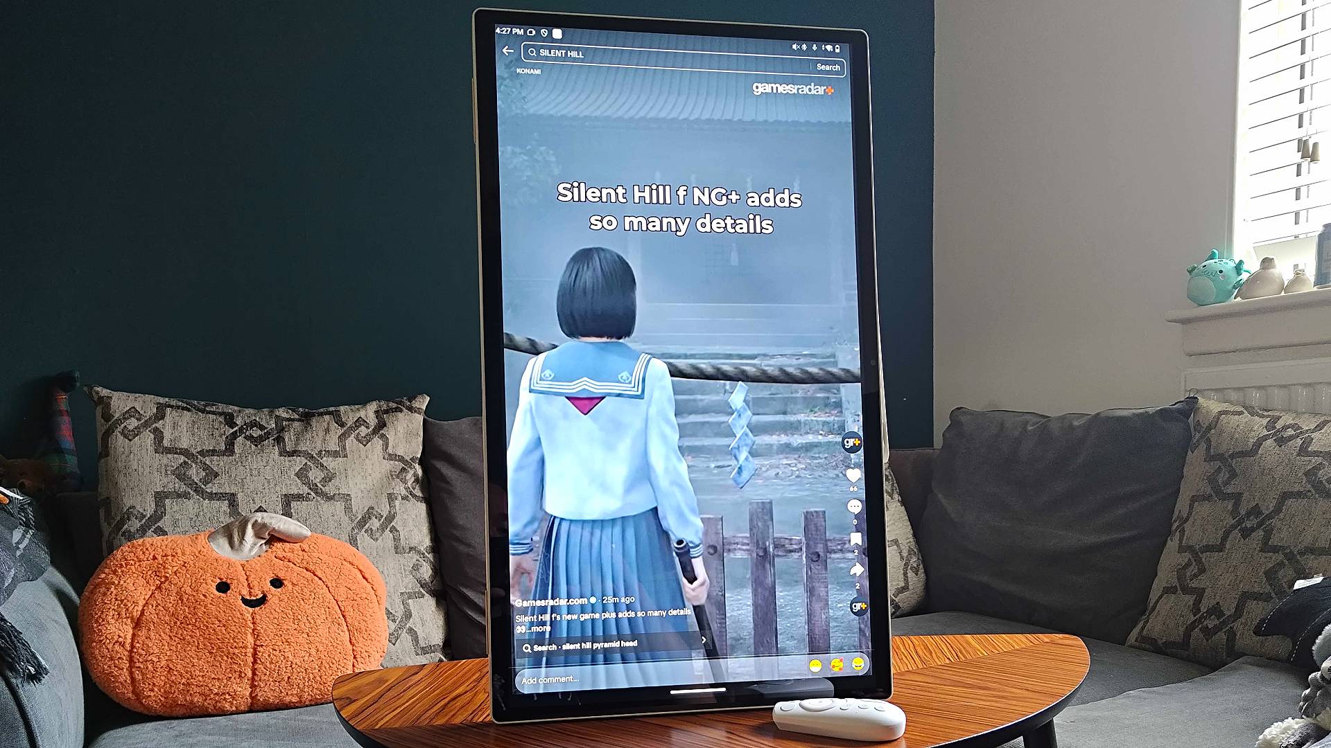 KTC MegPad portable monitor in portrait mode with TikTok GamesRadar+ video on screen.