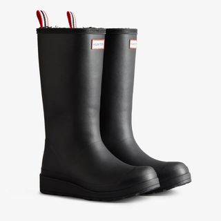 Cut out of black shearling lined Hunter wellies on a white background