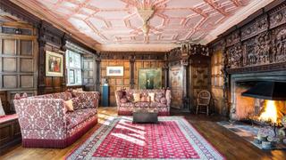 Interiors of a Grade I manor house, with decorative ceiling, wood panelling and fireplace