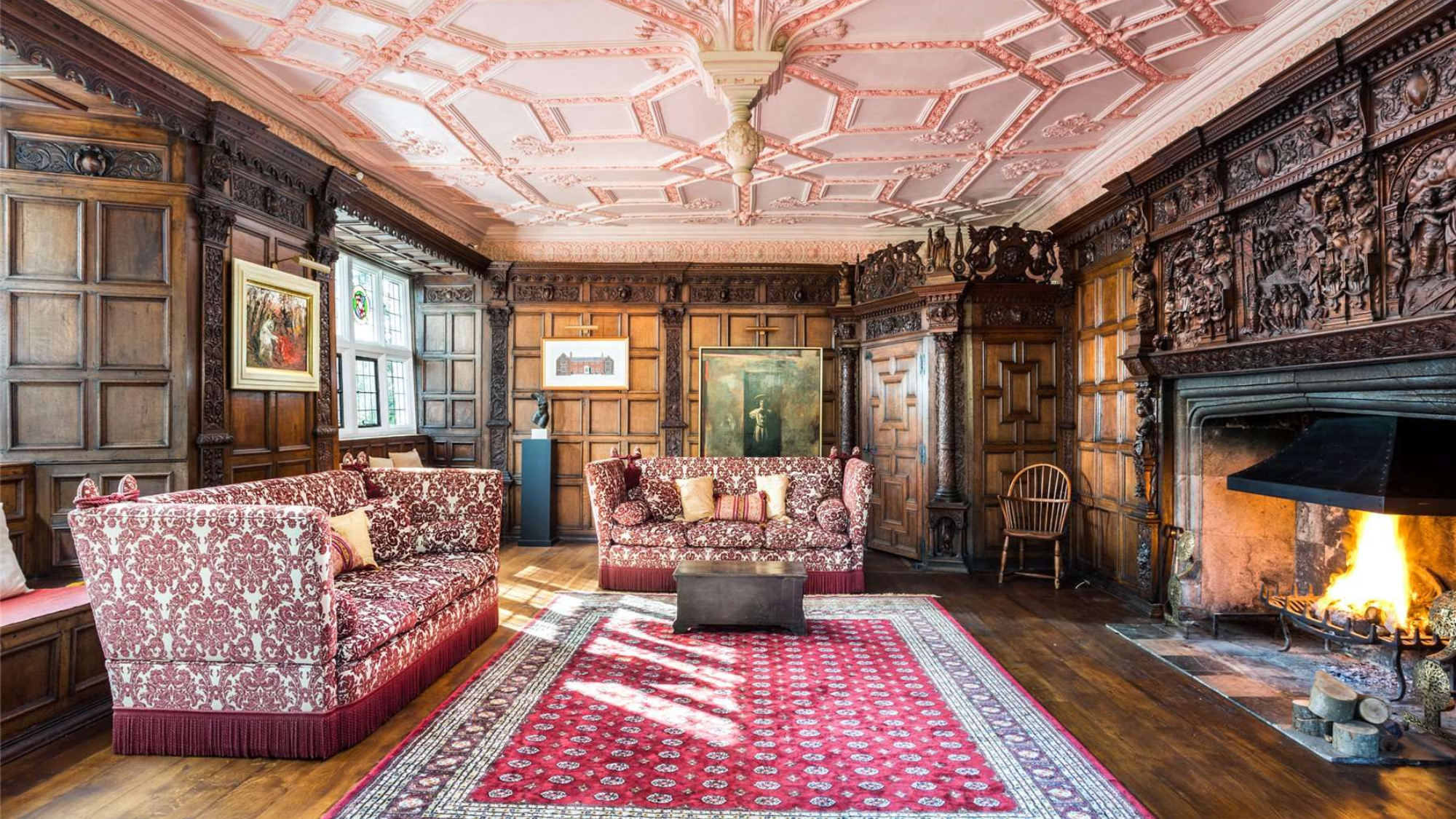 Interiors of a Grade I manor house, with decorative ceiling, wood panelling and fireplace