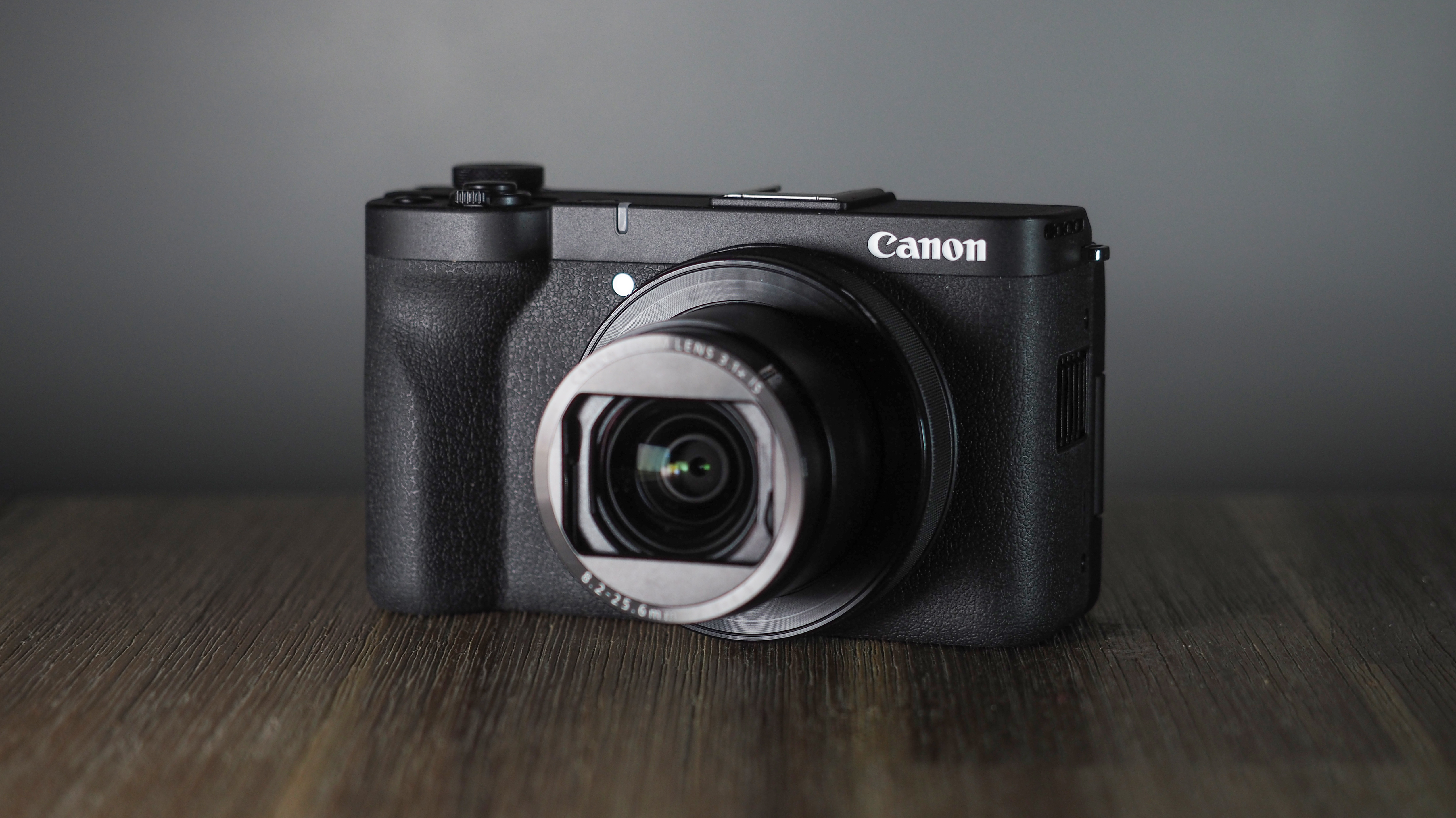 Canon PowerShot V1 on a wooden surface