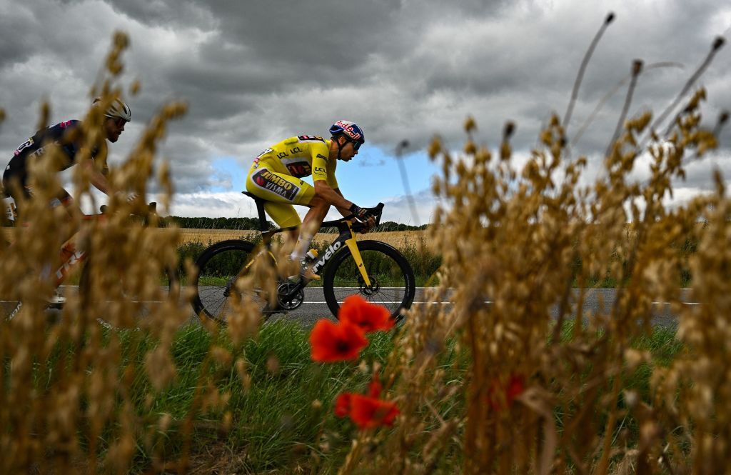 JumboVisma teams Belgian rider Wout Van Aert wearing the overall leaders yellow jersey cycles in a breakaway during the 6th stage of the 109th edition of the Tour de France cycling race 2199 km between Binche in Belgium and Longwy in northern France on July 7 2022 Photo by Marco BERTORELLO AFP Photo by MARCO BERTORELLOAFP via Getty Images