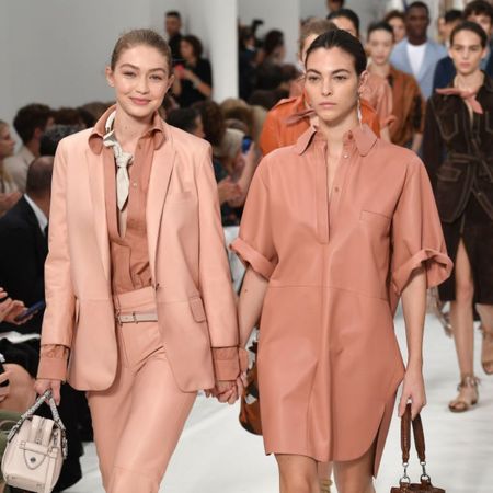 Gigi Hadid and Vittoria Ceretti walk the Tods runway together. 