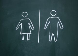 Male, female figures on chalkboard