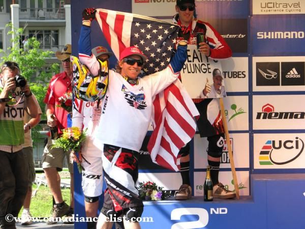 Aaron Gwin (Trek World racing) mounts the stage after winning