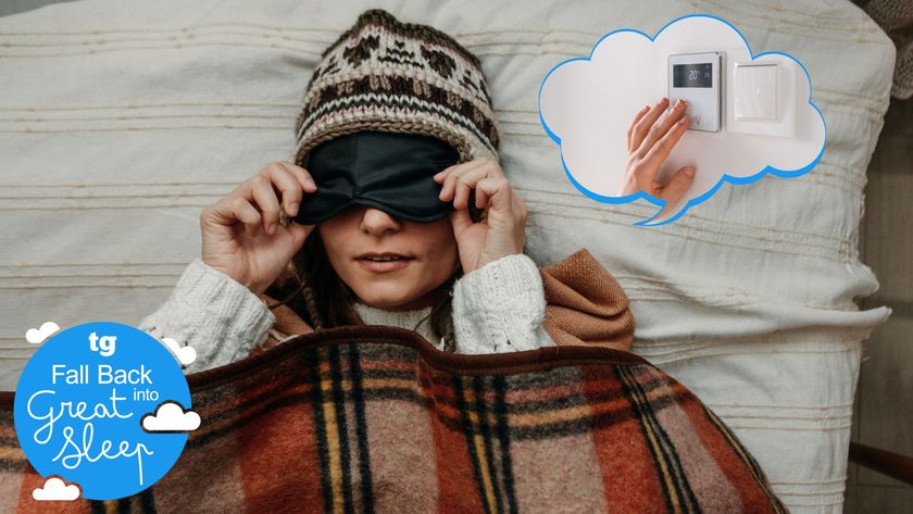 A woman wrapped up in a tarten blanket with a sleep mask and a woolly hat on. A thought bubble is coming out of her head with an image of a smart heating thermostat