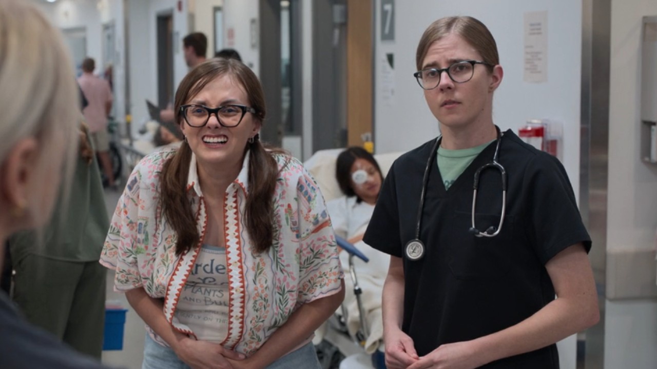 From left to right: Becca standing next to Mel on The Pitt.