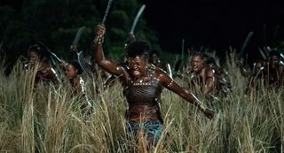 Viola Davis running as General Nanisca in The Woman King