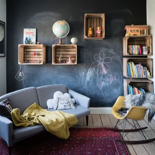 childrens bedroom with blackboard paint wall and shelf on wall