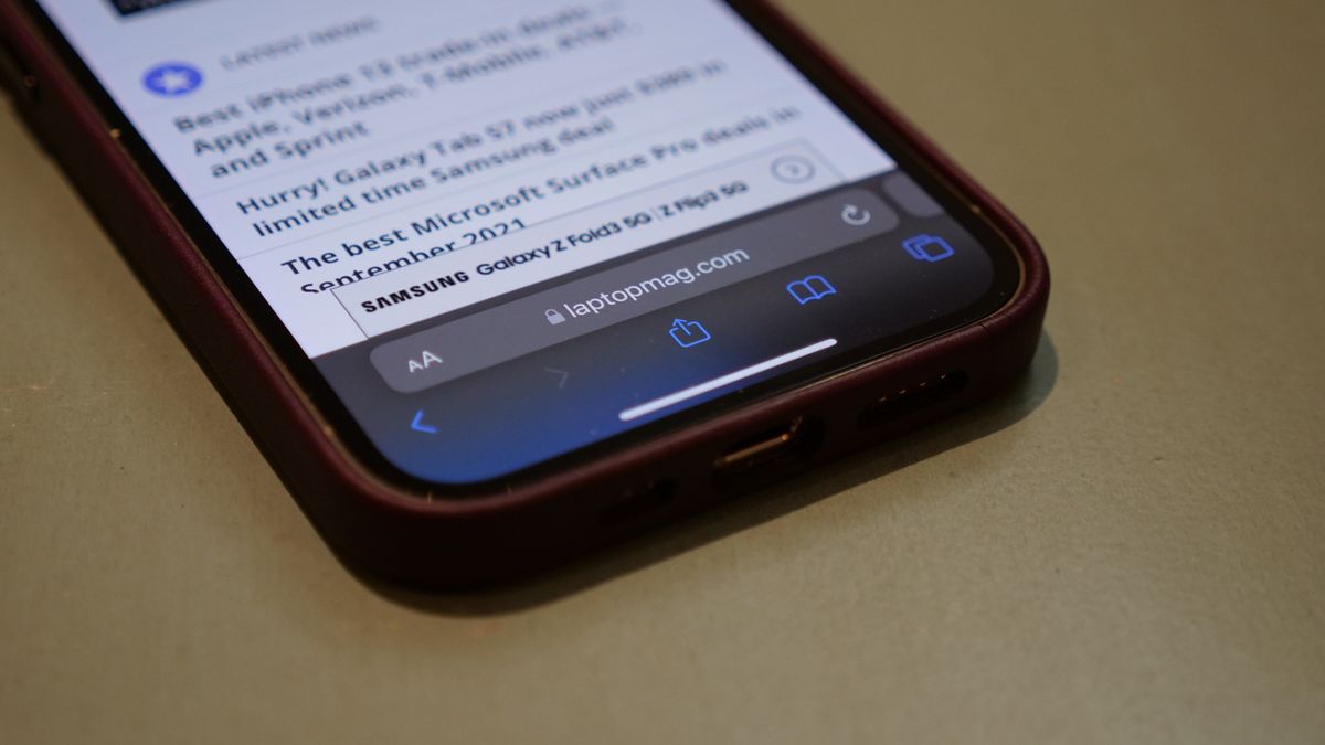 iOS 15 Safari browser showing laptopmag.com in the new bottom address bar