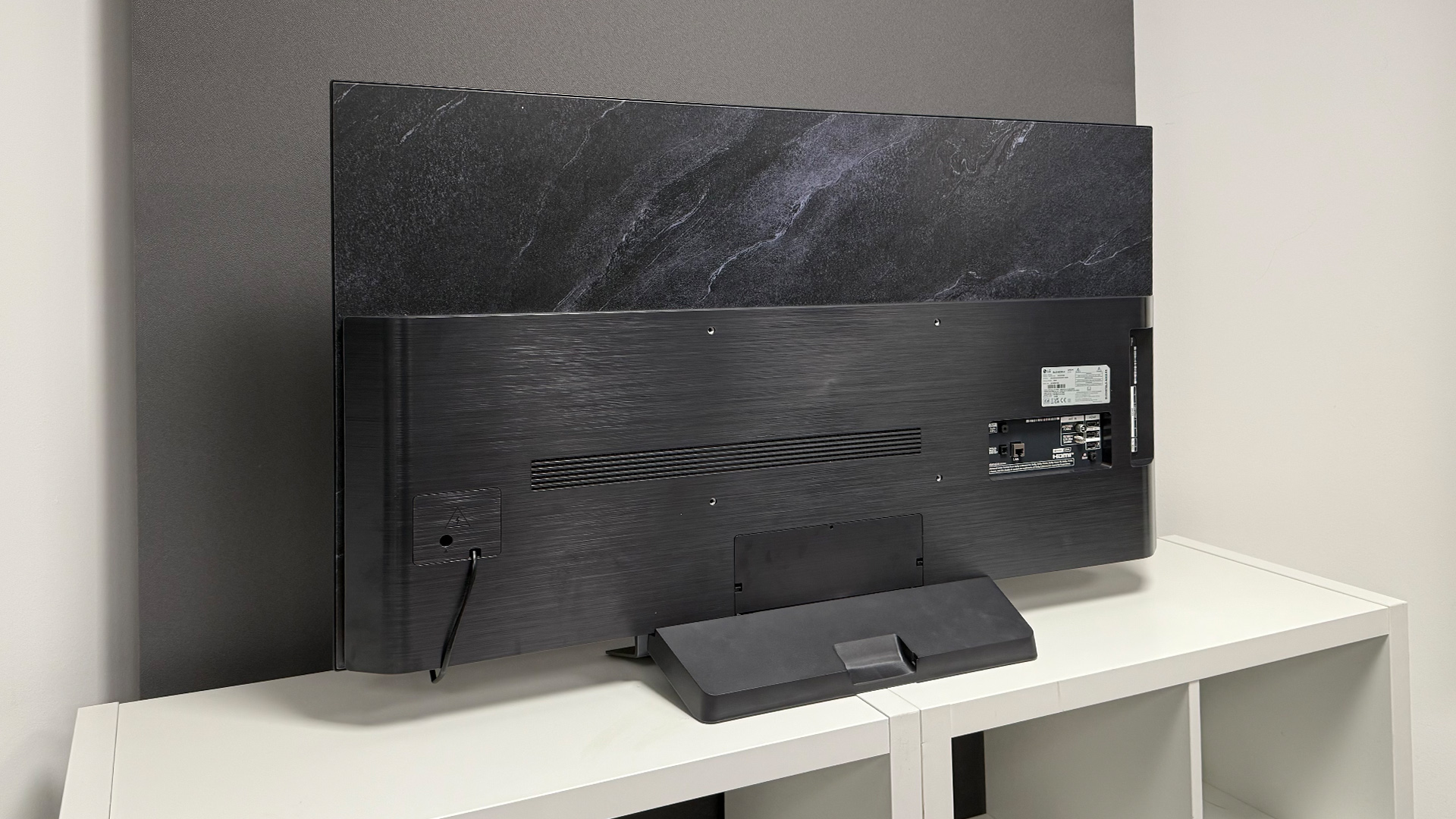 LG C5 48-inch OLED TV rear of set on white TV stand