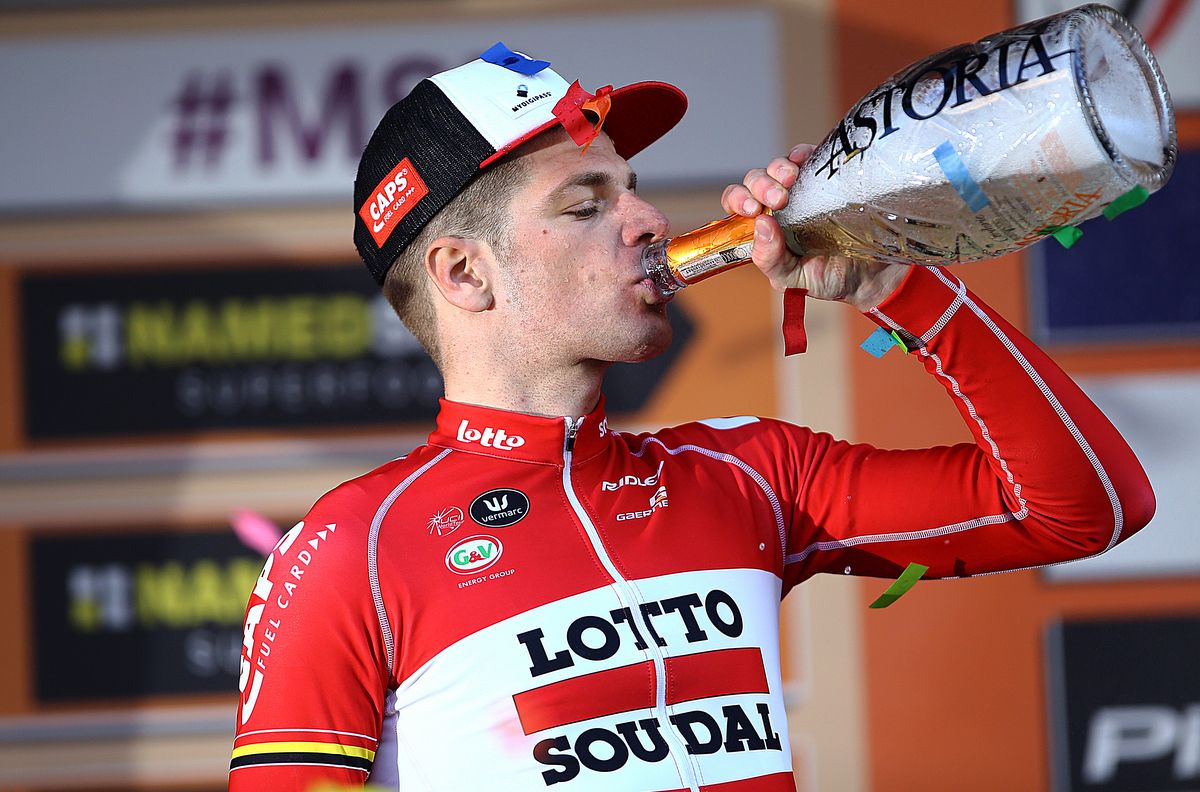 J&uuml;rgen Roelandts has a well earned drink on the podium