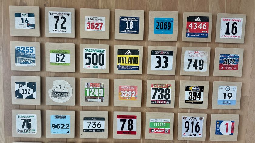 A wall of Strava employees&#039; race bibs at their new office in San Francisco