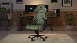 Corsair TC500 Luxe Gaming Chair in "Sherwood" green in front of a desk.