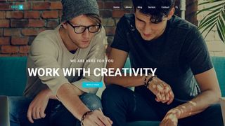 Free WordPress themes: ThemeX theme featuring two hipsters chatting in front of laptop