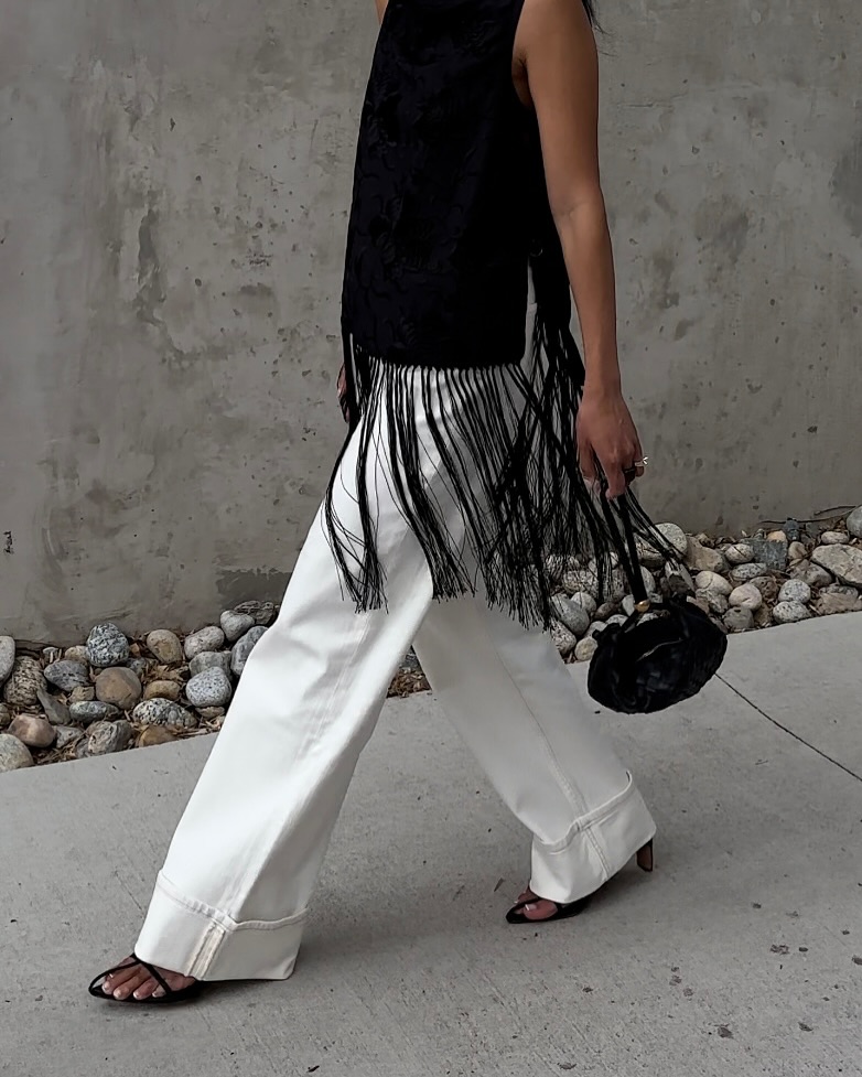 Dawn in white jeans and tassel top