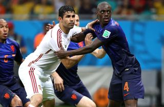 Diego Costa (left) in action for Spain against the Netherlands at the 2014 World Cup.