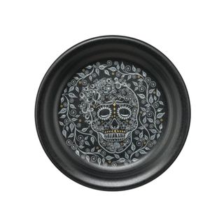A black plate with a Day of the Dead skull illustration