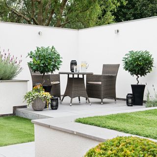 outdoor with white wall and table and chiar