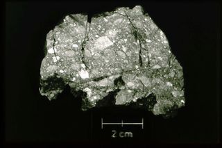 The moon rock shown here is an example of a lunar breccia, a rock that is composed of other rock fragments. Meteorite impacts on the moon are the main source of rock fragmentation on the lunar surface. Image released June 5, 2014.