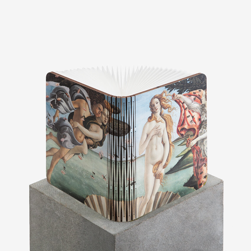 A book lamp showing the painting 