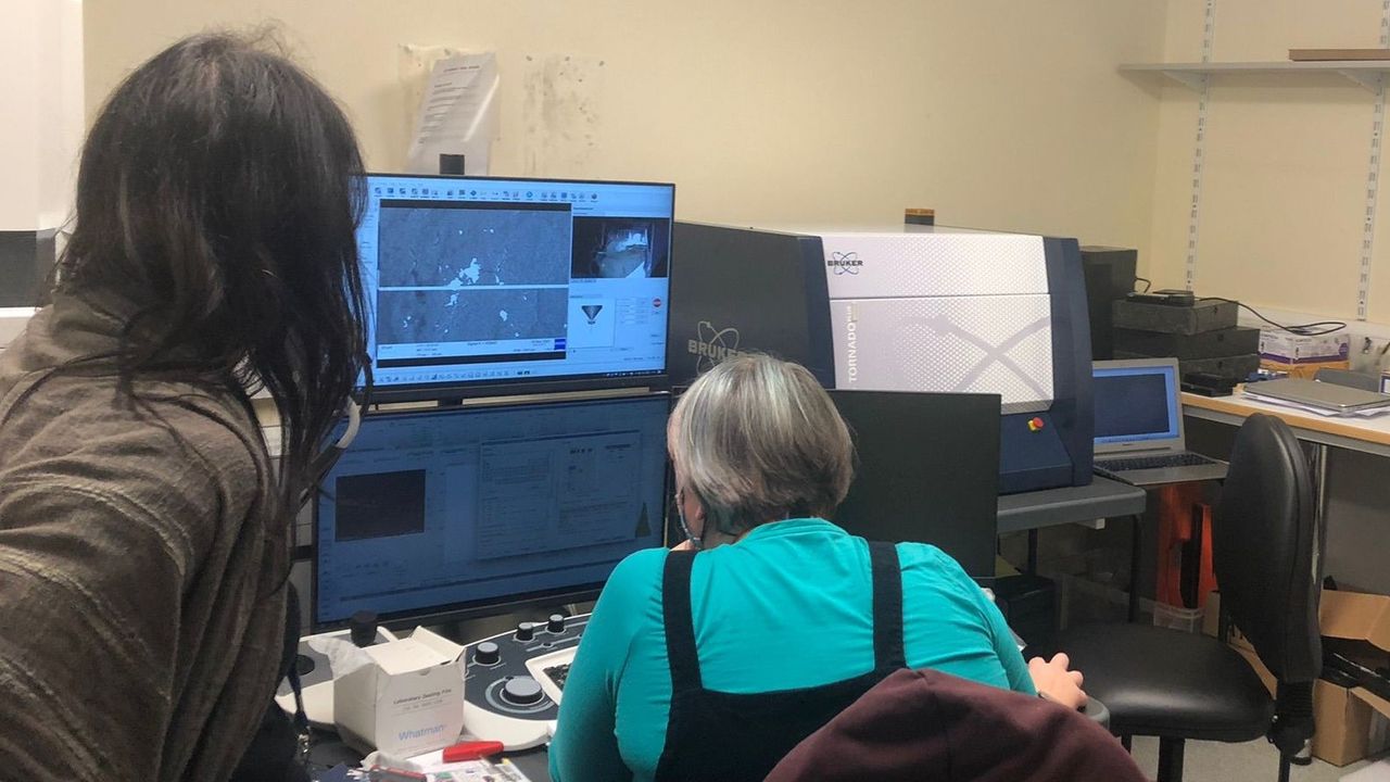 Researchers at University of Leicester analysing stone tools.