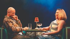 Jamael Westman and Marisha Wallace sitting opposite each other drinking cocktails