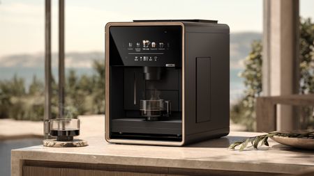 Loewe aura.matic espresso machine on outdoor table