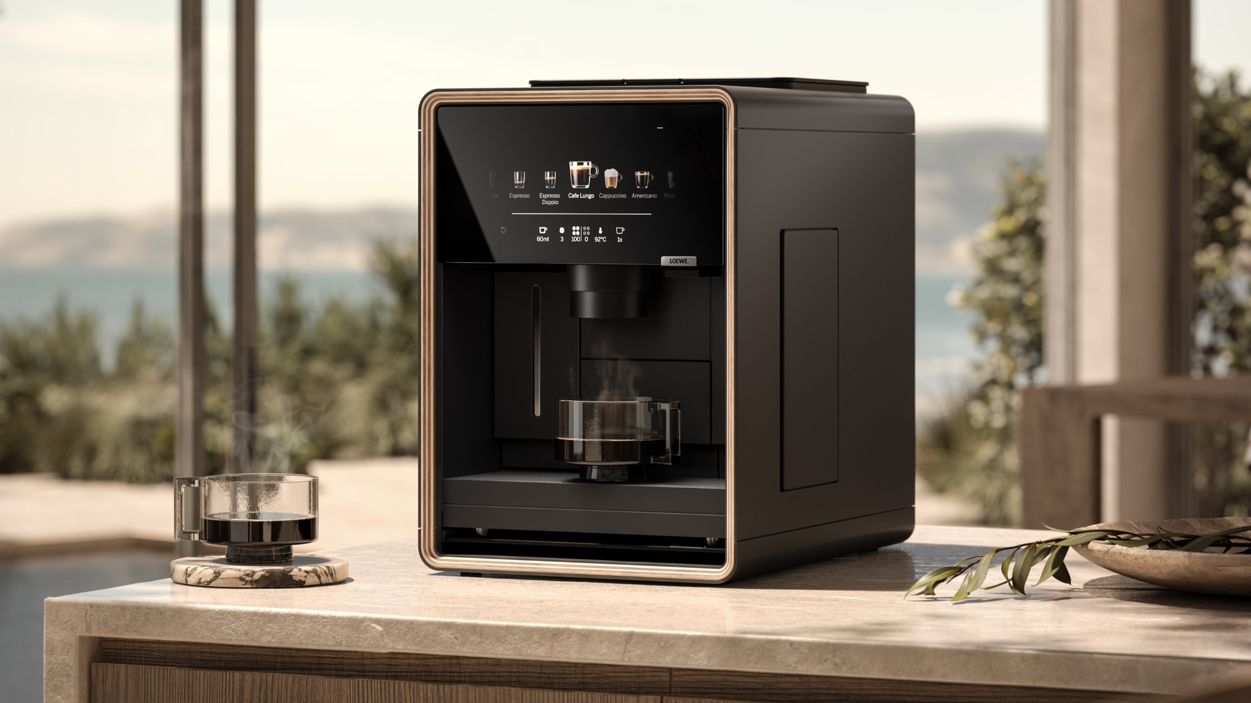 Loewe aura.matic espresso machine on outdoor table