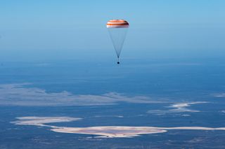 The Soyuz MS-15 spacecraft carrying three astronauts back from the International Space Station parachutes down to Earth before landing in Kazakhstan. NASA astronauts Jessica Meir and Drew Morgan and their Russian crewmember Oleg Skripochka of Roscosmos safely touched down today (April 17) at 1:16:43 a.m. EDT (0516 GMT or 11:16 a.m. local Kazakh time), southeast of the town of Dzhezkazgan.