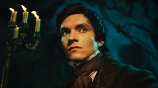 Fionn Whitehead in a dark suit and tie as Pip in Great Expectations.